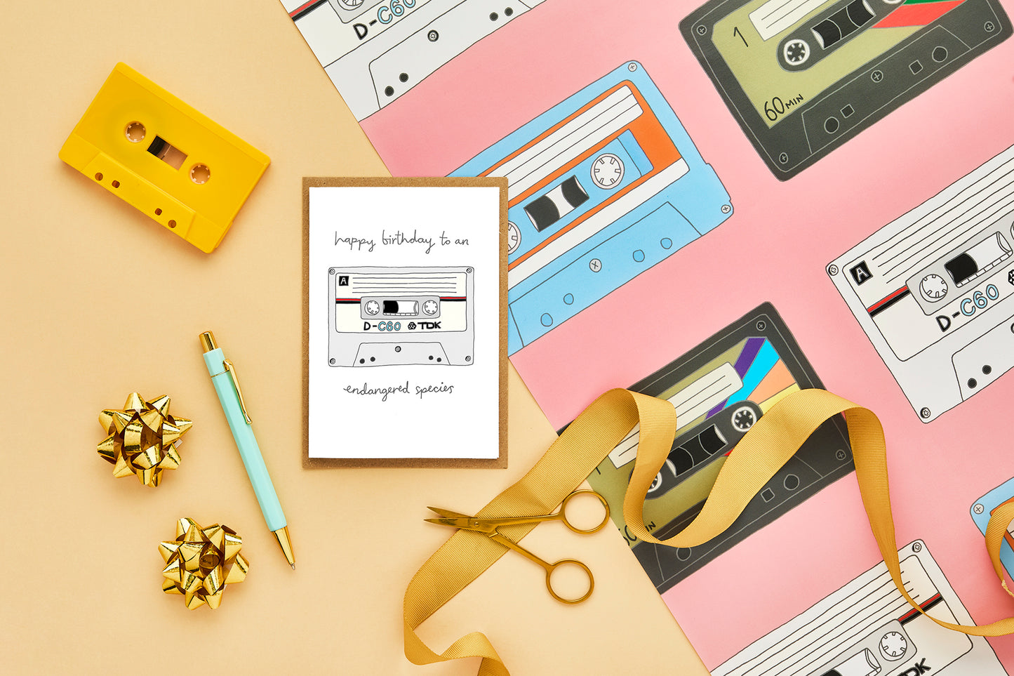 A retro birthday card and matching gift wrap featuring an illustration of a cassette tape