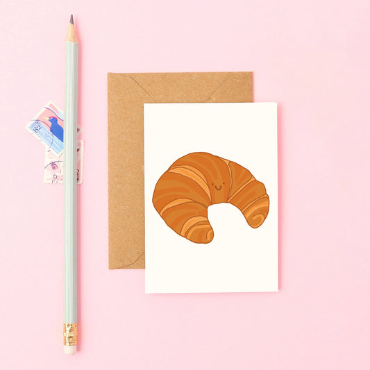 cute mini designer greeting card illustration with smiley croissant
