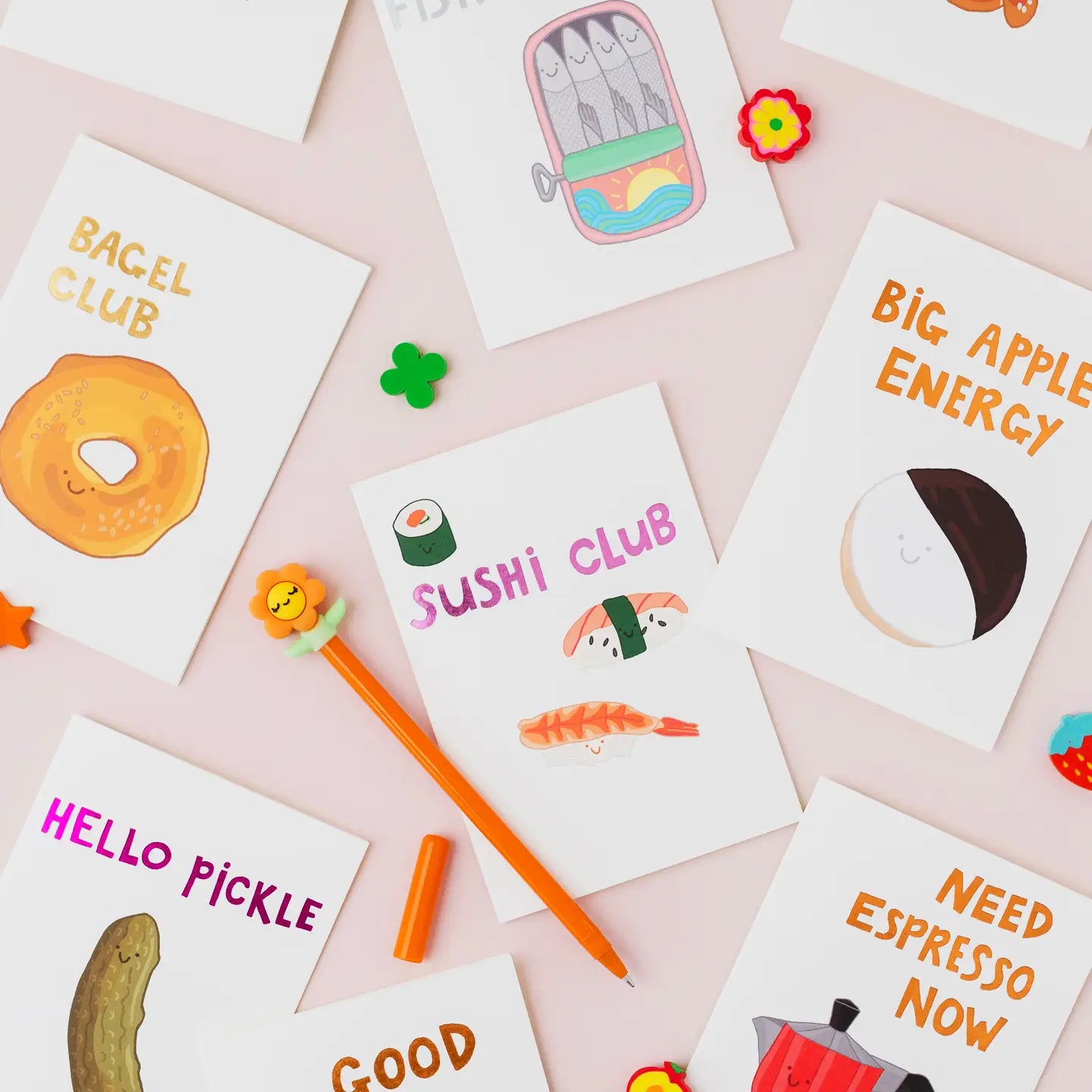 Collection of colourful greeting cards with hand drawn designs and hot foil lettering