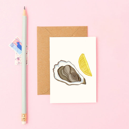 Hand-drawn smiling oyster with lemon slice, on a mini greeting card. Ideal for seafood lovers, bon voyage notes, and romantic gifts.