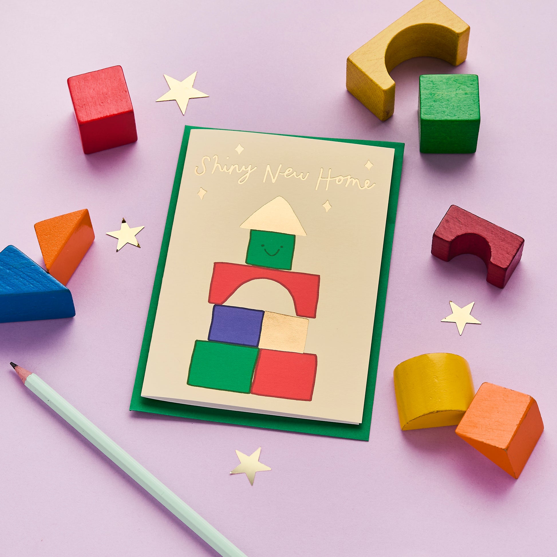 A Shiny New Home Card Featuring A Block Tower