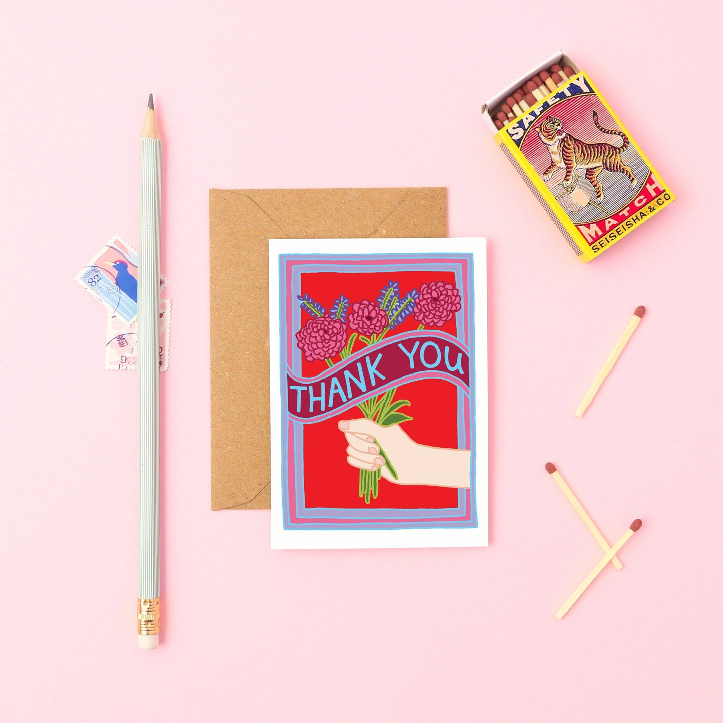 This mini card features a white hand holding a bunch of flowers