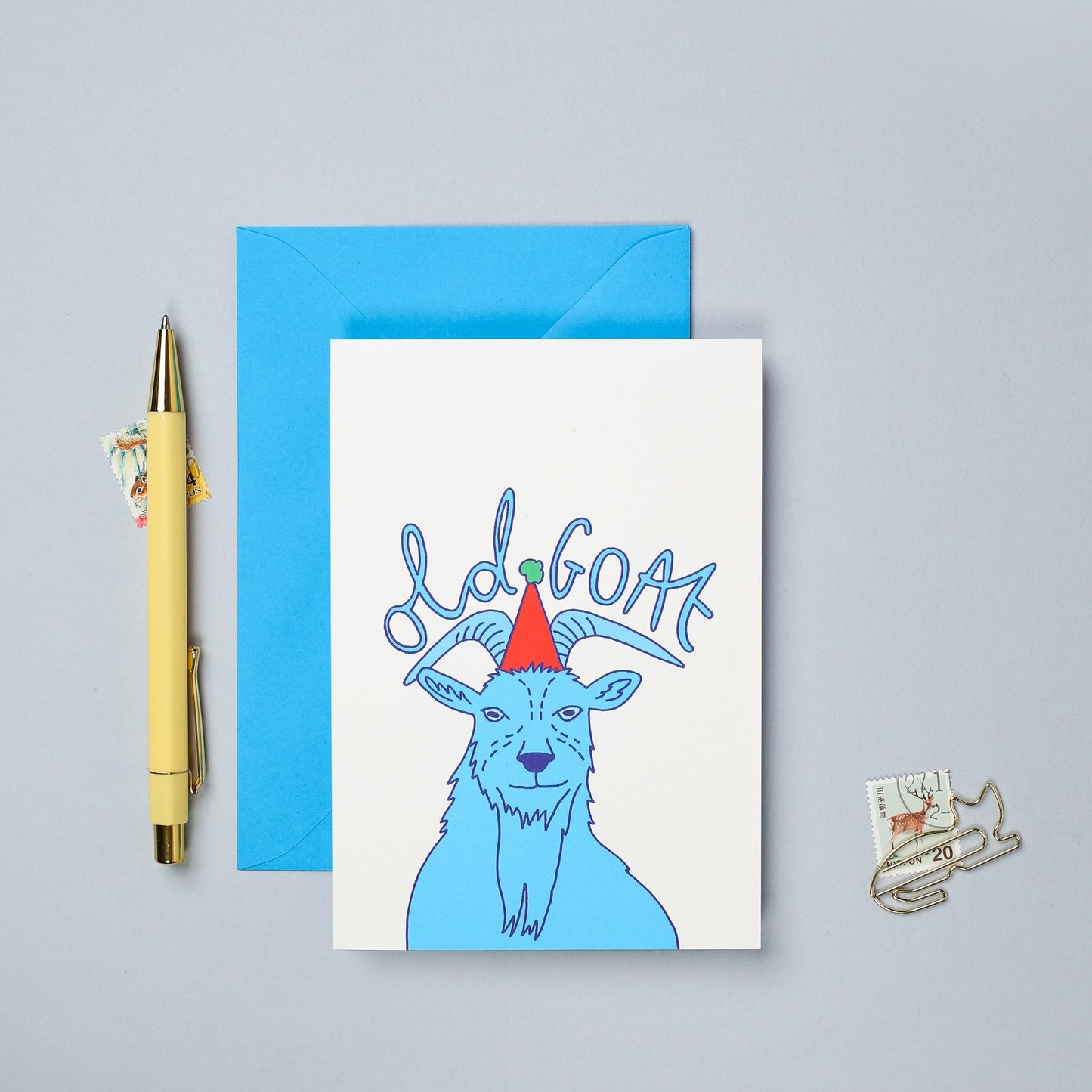 This hand drawn birthday card features a colourful illustration of a goat.