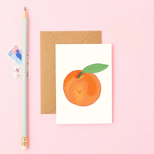 Mini peach card with smiling hand drawn orange peach and green leaf