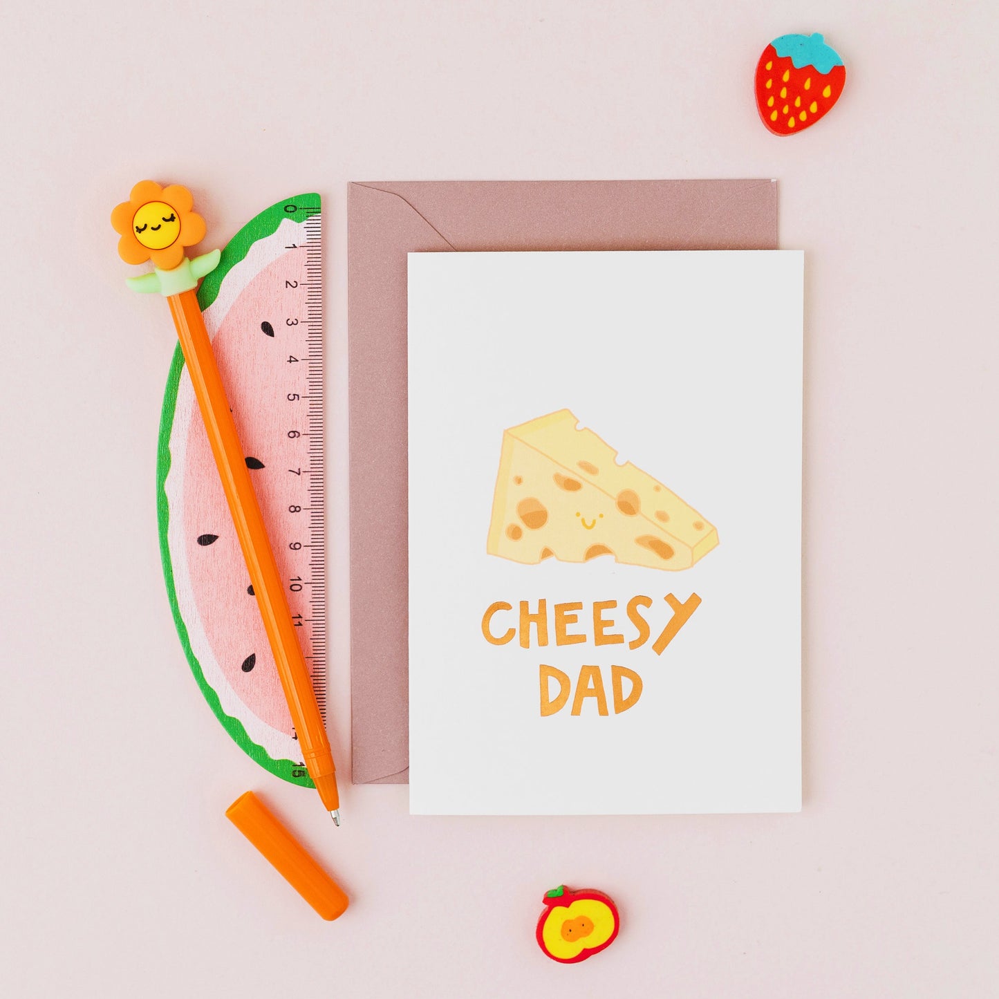 Cheesy Dad Father's Day card featuring a smiling wedge of cheese with gold foil lettering on a contemporary cream background.