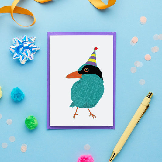 An Illustrated Birthday Card Featuring a Green Magpie