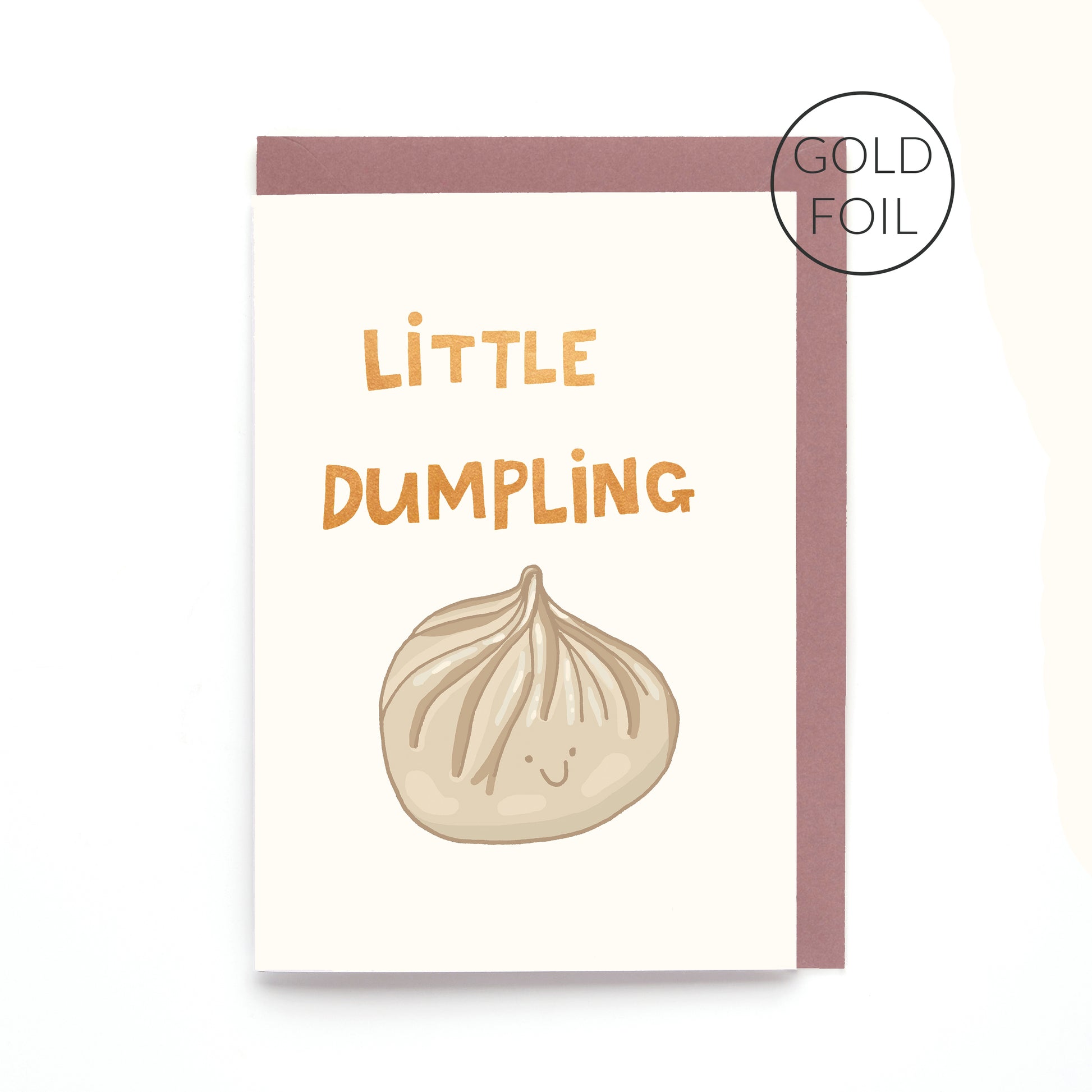 Little Dumpling greeting card featuring a smiling steamed dumpling with gold foil lettering on a contemporary white background.