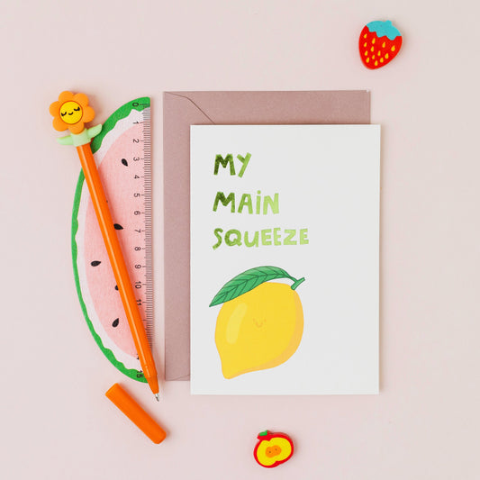 My Main Squeeze greeting card featuring a smiling lemon with gold foil lettering on a contemporary white background.