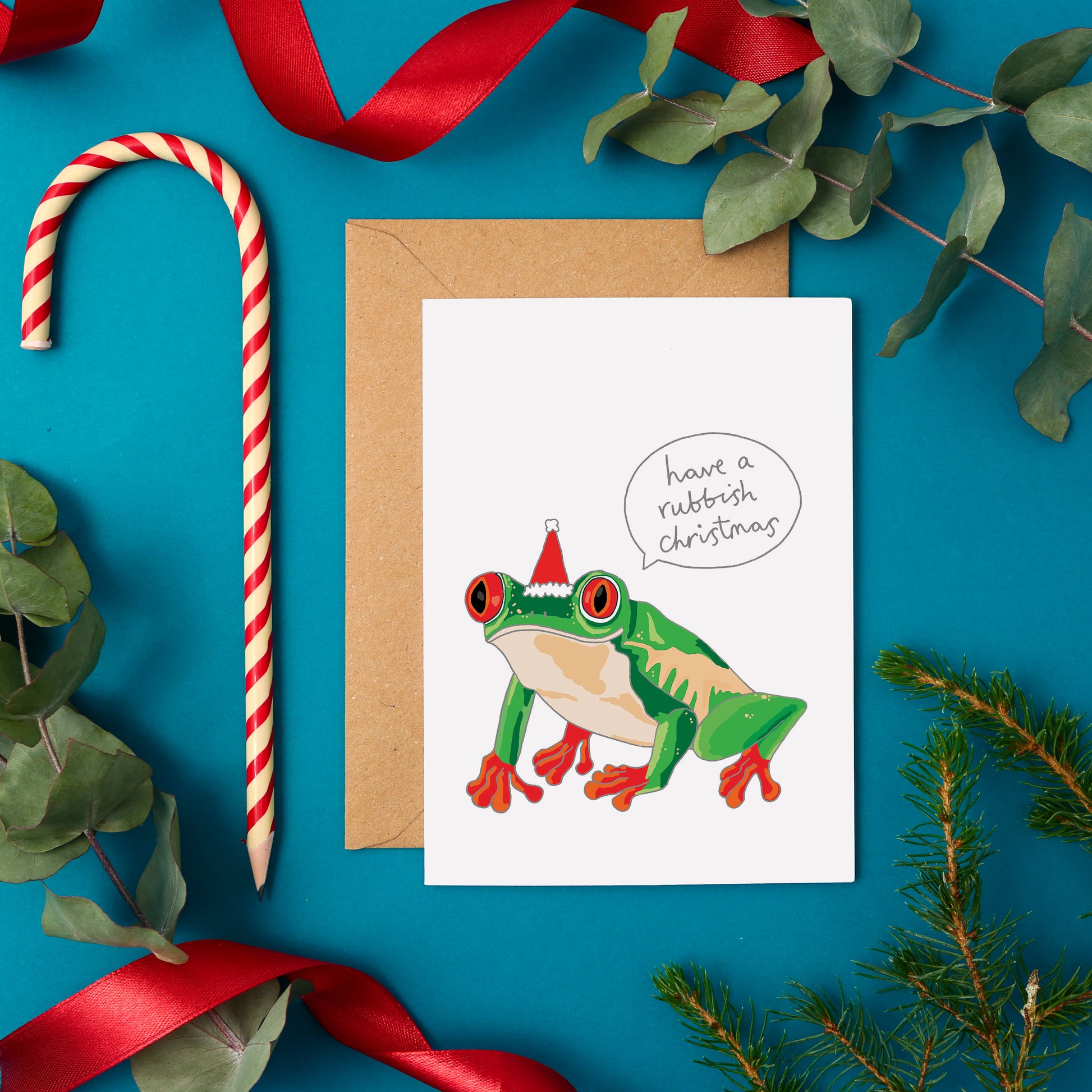 A Funny Christmas Card Featuring a Frog in a Christmas Hat