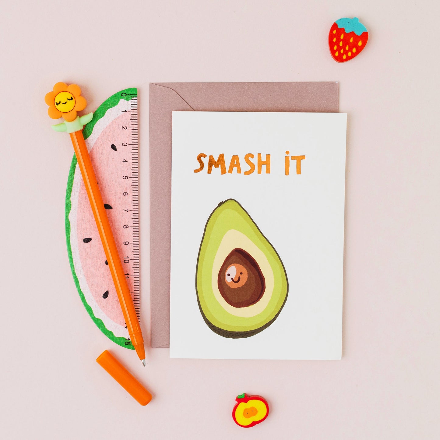 Smash It greeting card featuring a smiling avocado with gold foil lettering on a white background.