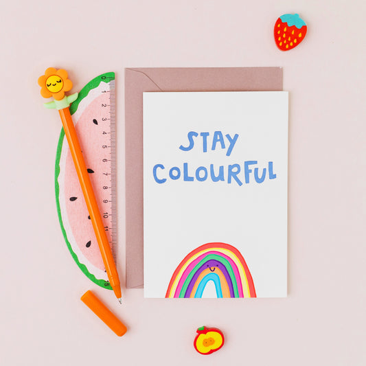 Hand drawn rainbow greeting card with the words "Stay Colourful" finished with gold foil on a white background.
