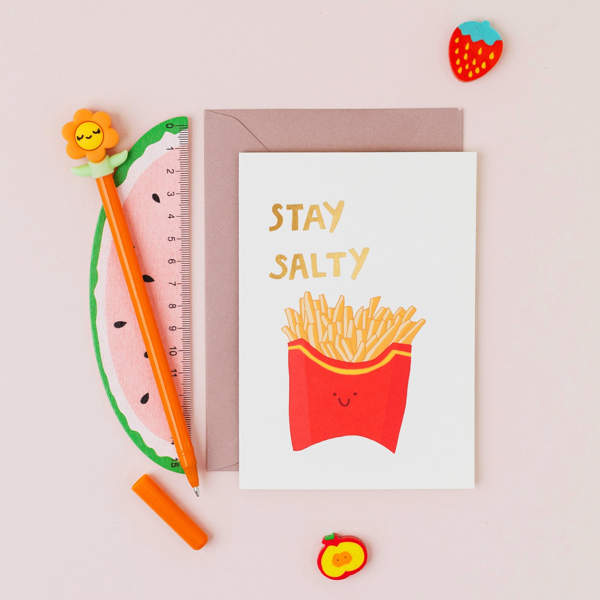 Funny chips greeting card reading "Stay Salty" with gold foil lettering on a white background.
