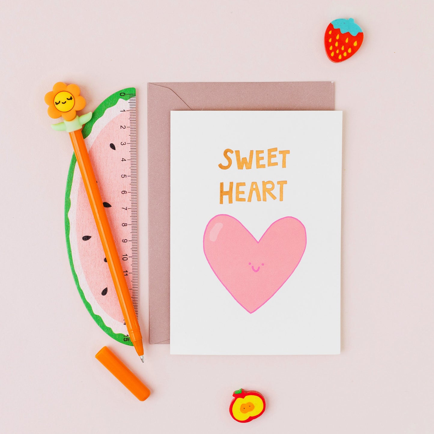 Hand drawn pink heart greeting card with the words 'Sweet Heart' in gold foil on a white background.