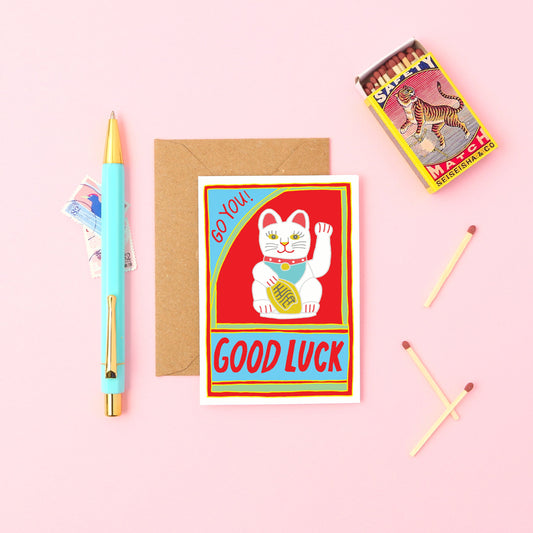This mini card features a waving cat