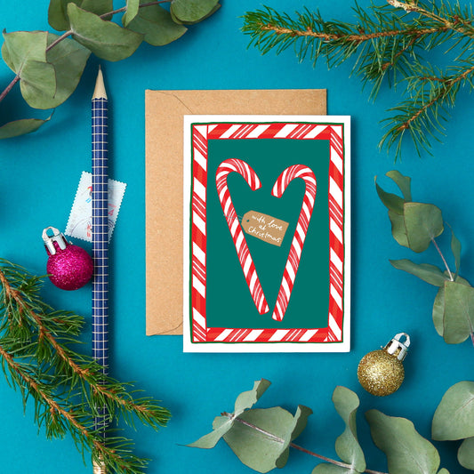 This mini card features candy canes