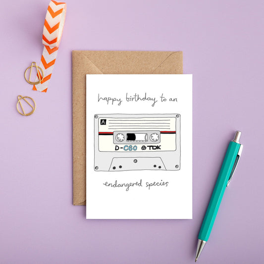A retro birthday card with an illustration of a cassette