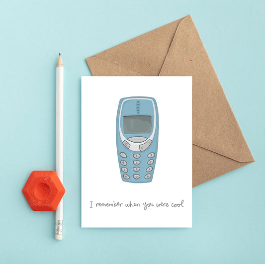 A retro birthday card with an illustration of a nokia