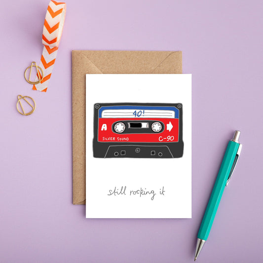 A retro birthday card with an illustration of a cassette