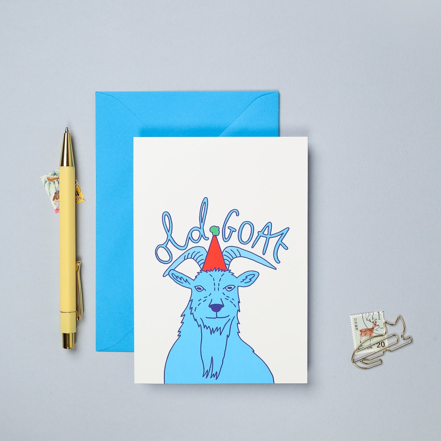 This hand drawn birthday card features a colourful illustration of a goat.