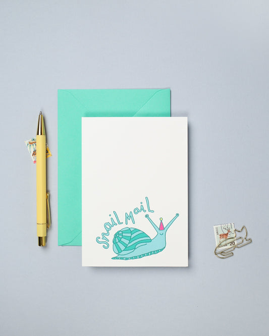 This hand drawn birthday card features a colourful illustration of a snail.