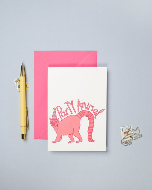 This hand drawn birthday card features a colourful illustration of a lemur.