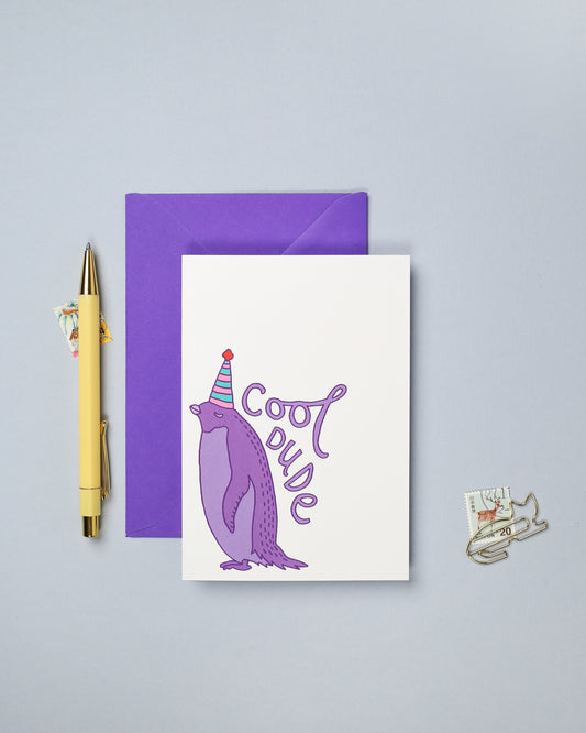 This hand drawn birthday card features a colourful illustration of a penguin.